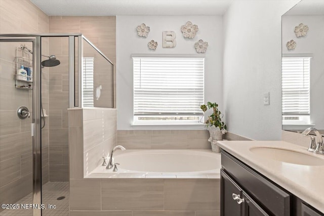 full bathroom with a garden tub, vanity, and a stall shower