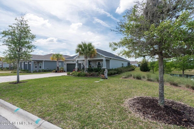 ranch-style home featuring a garage, a front yard, and concrete driveway