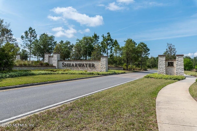 community sign with a lawn