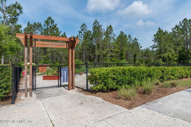 view of gate with fence