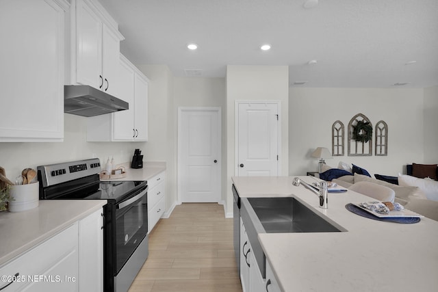 143 Bayard Pl, Jacksonville, FL 32259 - kitchen featuring a sink, under cabinet range hood, stainless steel appliances, white cabinetry, and open floor plan