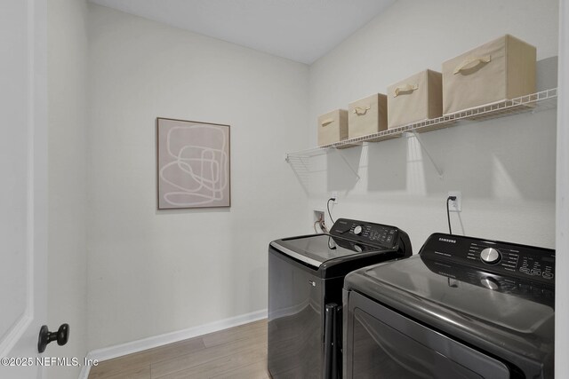 143 Bayard Pl, Jacksonville, FL 32259 - laundry area with light wood-style floors, baseboards, laundry area, and independent washer and dryer