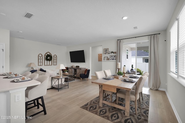 143 Bayard Pl, Jacksonville, FL 32259 - dining area featuring visible vents, light wood-style floors, and baseboards