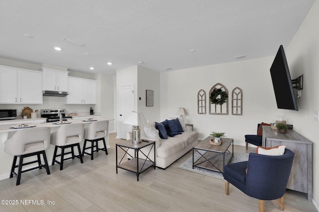 143 Bayard Pl, Jacksonville, FL 32259 - living area featuring recessed lighting, baseboards, light wood-type flooring, and a textured ceiling