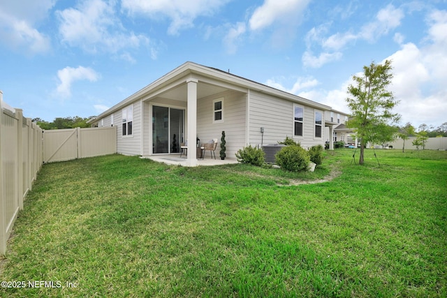 143 Bayard Pl, Jacksonville, FL 32259 - rear view of house with a lawn, a patio, a gate, and a fenced backyard
