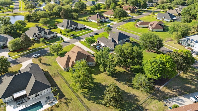 aerial view featuring a residential view and a water view