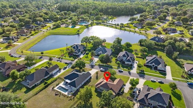aerial view with a residential view and a water view