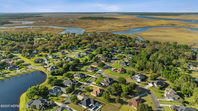 bird's eye view featuring a residential view and a water view