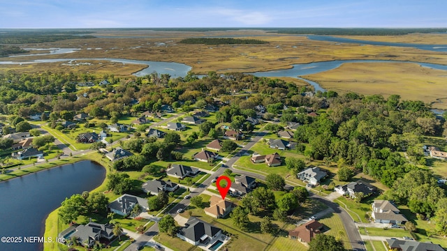 bird's eye view with a residential view and a water view