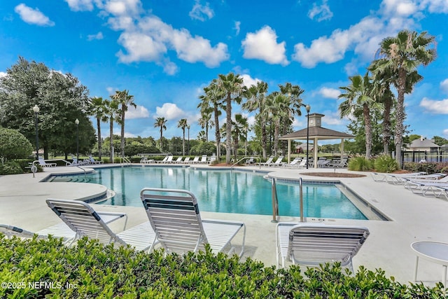 pool featuring a gazebo and a patio area