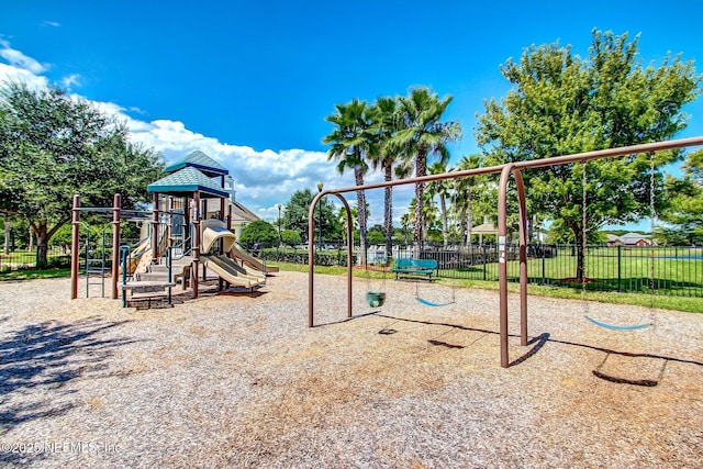 community jungle gym featuring fence