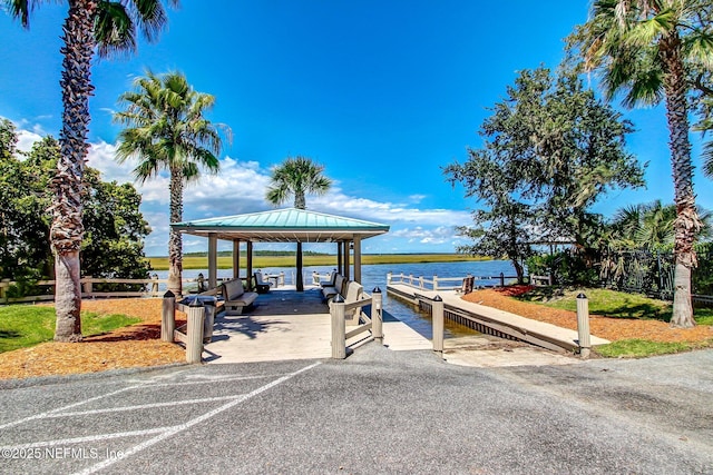 dock area featuring a gazebo and a water view