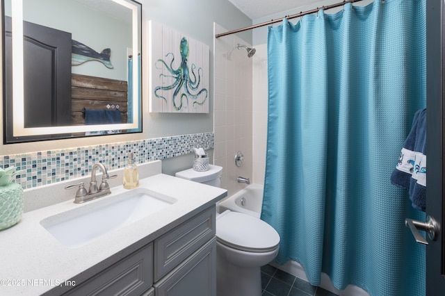 full bathroom with tile patterned floors, tasteful backsplash, toilet, shower / bath combination with curtain, and vanity