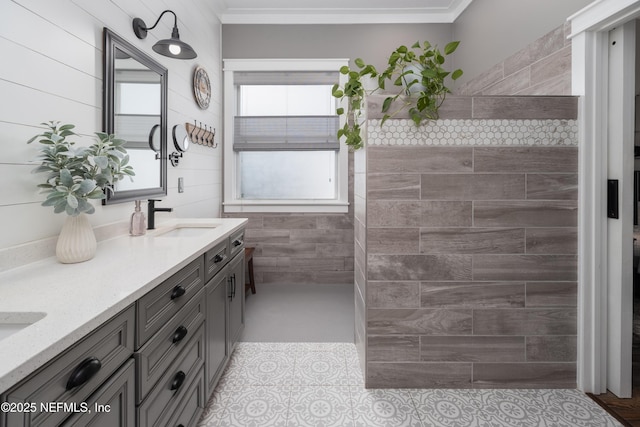 full bathroom with crown molding, a sink, a walk in shower, and double vanity