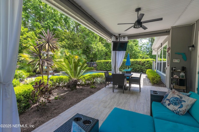 view of patio featuring outdoor dining area and ceiling fan