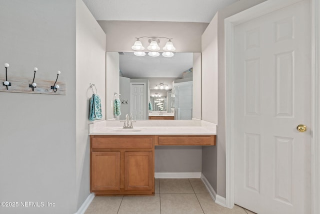 322 Cooper Bay Ct, Saint Augustine, FL 32092 - bathroom with vanity, tile patterned flooring, and baseboards
