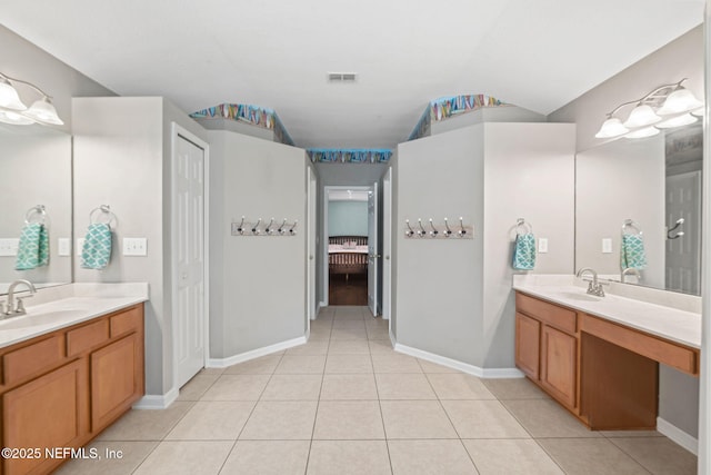 322 Cooper Bay Ct, Saint Augustine, FL 32092 - full bathroom featuring visible vents, two vanities, a sink, and tile patterned flooring