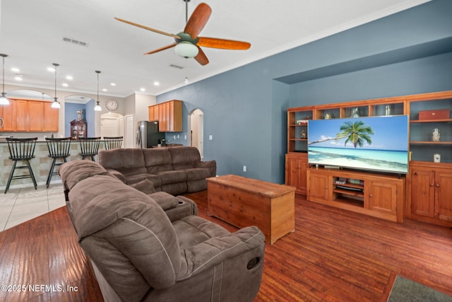 322 Cooper Bay Ct, Saint Augustine, FL 32092 - living room featuring crown molding, arched walkways, a ceiling fan, recessed lighting, and visible vents