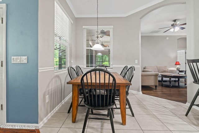 322 Cooper Bay Ct, Saint Augustine, FL 32092 - dining area featuring arched walkways, ceiling fan, light tile patterned flooring, and ornamental molding