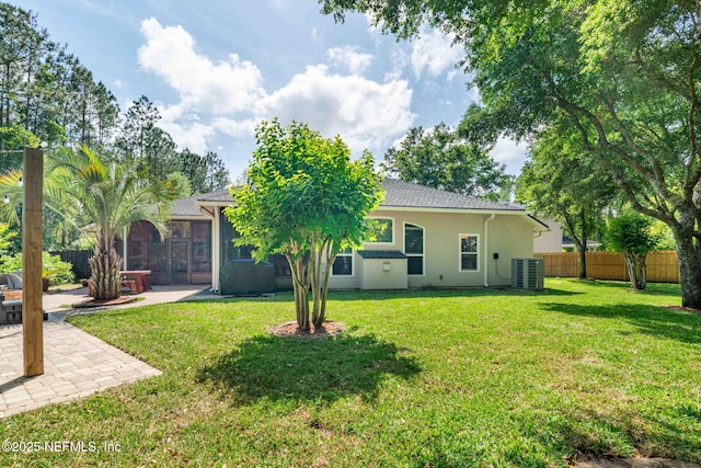 322 Cooper Bay Ct, Saint Augustine, FL 32092 - rear view of house featuring central air condition unit, fence, a yard, a patio, and stucco siding