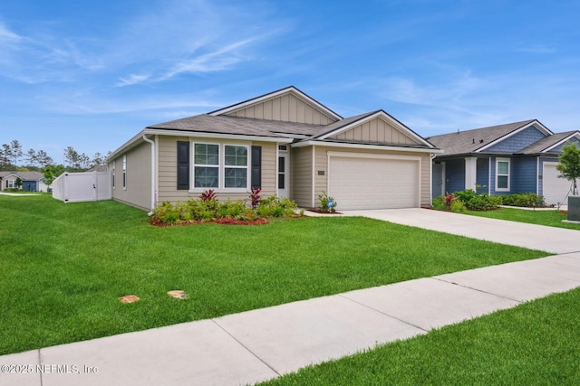 3044 Rustic Deer Way, Green Cove Springs, FL 32043 - ranch-style home featuring board and batten siding, an attached garage, a front lawn, and concrete driveway