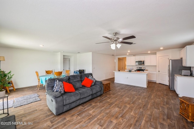 3044 Rustic Deer Way, Green Cove Springs, FL 32043 - living area featuring baseboards, recessed lighting, ceiling fan, and dark wood-style flooring