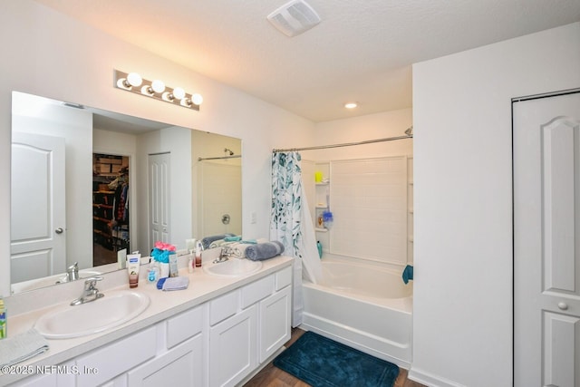 3044 Rustic Deer Way, Green Cove Springs, FL 32043 - full bath featuring double vanity, visible vents, shower / bath combo with shower curtain, and a sink