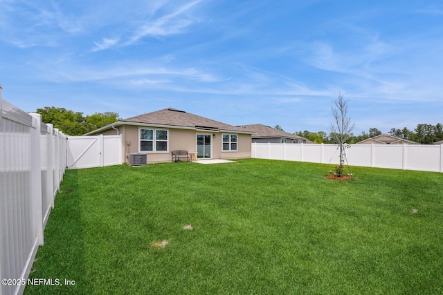 3044 Rustic Deer Way, Green Cove Springs, FL 32043 - rear view of house featuring a gate, a patio area, a lawn, central air condition unit, and a fenced backyard
