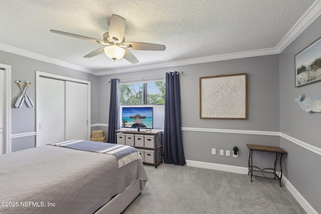carpeted bedroom with crown molding, a textured ceiling, baseboards, and ceiling fan