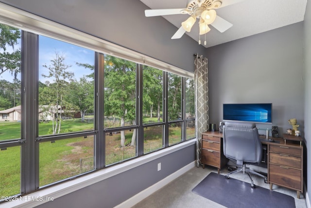 office area with baseboards, a ceiling fan, and carpet