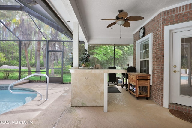 view of patio with an outdoor pool, outdoor dry bar, an outdoor kitchen, a ceiling fan, and glass enclosure