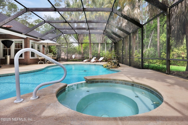 view of swimming pool featuring a patio and a pool with connected hot tub