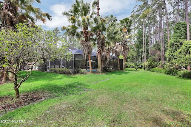 view of yard with a lanai