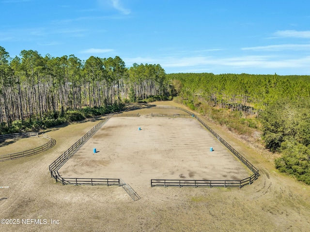 aerial view featuring a wooded view