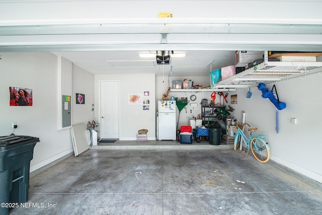 291 Whisper Rock Dr, Ponte Vedra, FL 32081 - garage with freestanding refrigerator, a garage door opener, electric panel, and baseboards