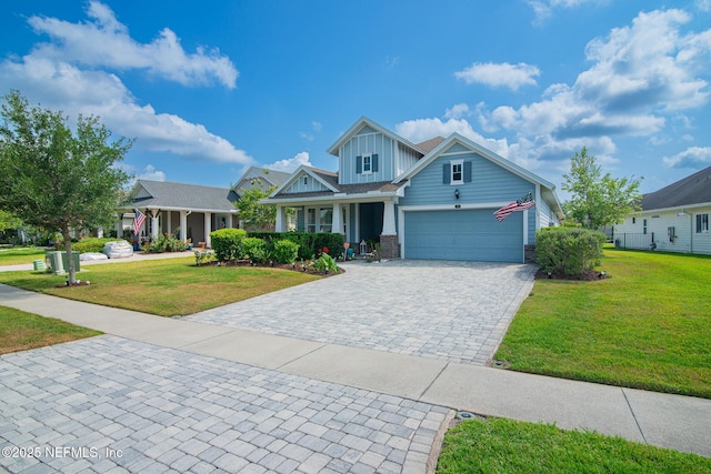 291 Whisper Rock Dr, Ponte Vedra, FL 32081 - craftsman-style house featuring a front yard, board and batten siding, decorative driveway, and covered porch