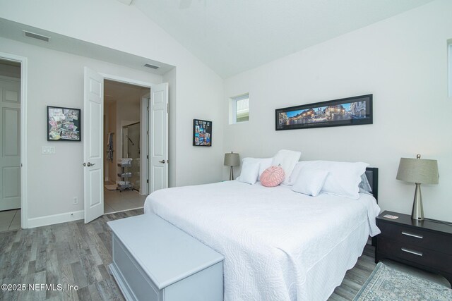 291 Whisper Rock Dr, Ponte Vedra, FL 32081 - bedroom with light wood-type flooring, lofted ceiling, and baseboards