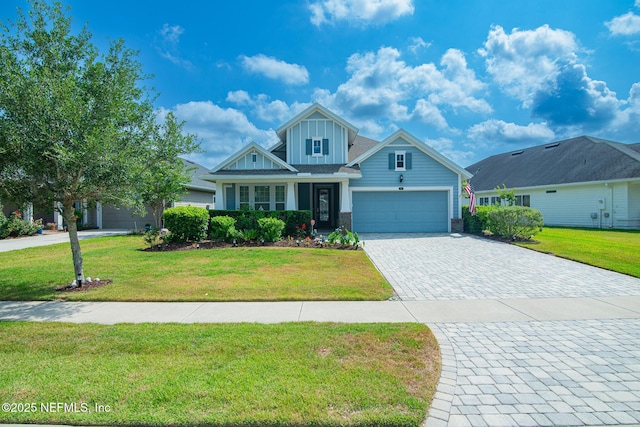 291 Whisper Rock Dr, Ponte Vedra, FL 32081 - craftsman house with board and batten siding, a front yard, decorative driveway, and a garage