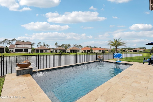 view of swimming pool with a fenced in pool, a fenced backyard, a residential view, a water view, and a patio area