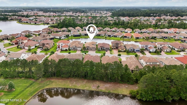 bird's eye view with a residential view and a water view