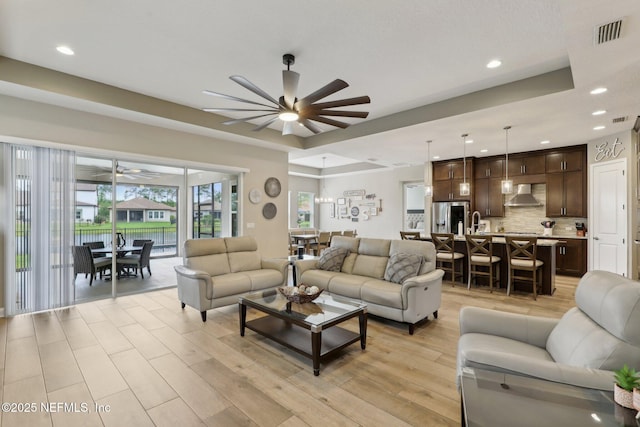 living room featuring visible vents, recessed lighting, and ceiling fan