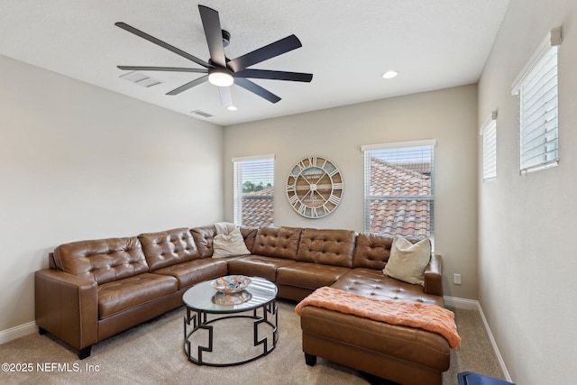 carpeted living area with baseboards, visible vents, recessed lighting, and ceiling fan