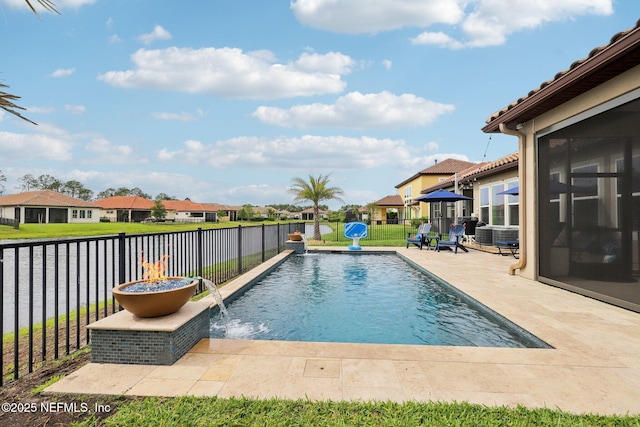 view of swimming pool featuring a patio area, a fenced backyard, and a residential view