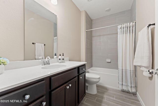 full bathroom with wood finish floors, shower / bath combination with curtain, toilet, and vanity