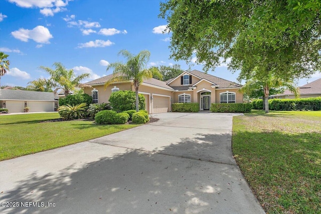 1124 Westfield Way, Saint Augustine, FL 32095 - view of front of home featuring driveway, a front yard, stucco siding, and a garage