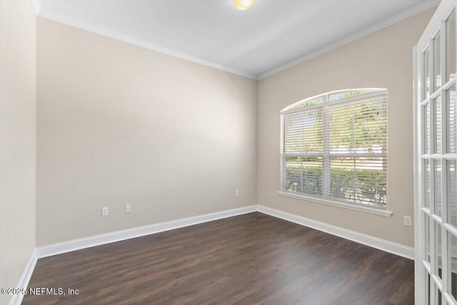 1124 Westfield Way, Saint Augustine, FL 32095 - empty room featuring ornamental molding, baseboards, and dark wood-type flooring
