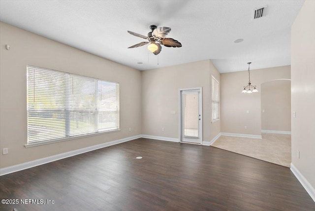 1124 Westfield Way, Saint Augustine, FL 32095 - interior space with visible vents, baseboards, arched walkways, wood finished floors, and ceiling fan with notable chandelier