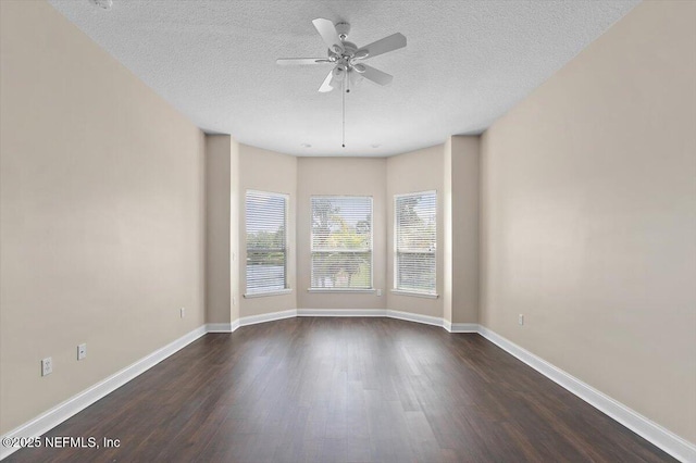 1124 Westfield Way, Saint Augustine, FL 32095 - spare room with a textured ceiling, ceiling fan, dark wood finished floors, and baseboards