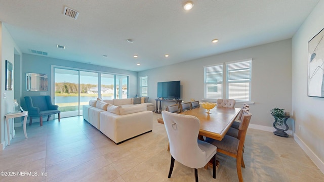 dining room featuring a wealth of natural light and visible vents