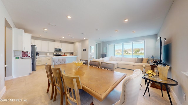 dining space featuring recessed lighting, visible vents, baseboards, and light tile patterned floors